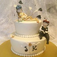 Karina & John wedding cake for our best friends, they own racing stables and are rarely seen without their hats on, so i had to have them wearing their...