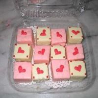 Pretty Sweet since I've extra batch of brownies, I coated them with colored candy& piped red hearts on them. suitable for Valentine's day...