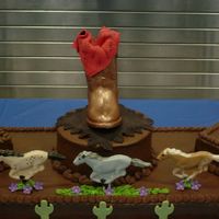 Boot 48" long cake - This was done for a western band party. Chocolate boot and horses. Fondant bandana, sunflowers and cactus