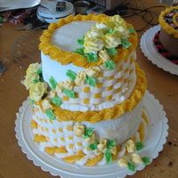 70Th B-Day Tried to copy a cake I saw in the gallery. All buttercream. Used canned spray coloring on the roses.