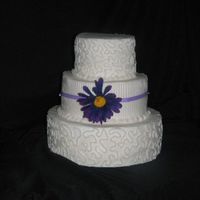Purple Lace Just a practice dummy cake. The flower is an ugly dollar store find lol. Wanted to try the Croneli lace