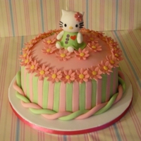 Hello Kitty Hello Kitty birthday cake for my little cousin's 21st. Loved modelling kitty & kept the rest of the design to a minimum.