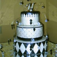 Jeweled Wedding Cake White chocolate cake covered in black and white MMF and brushed with super pearl dust. This cake was designed by the bride.....I wasn'...