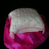Practice Pillow Cake This is my first pillow cake. All MMF. Had a little trouble with smoothing the fondant on the underside of the cake...anyone with advice on...