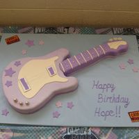 Hope's Guitar Cake This cake was for my daughter's 6th birthday which was a 'Camp Rock' theme. White cake covered in MMF w/ gumpaste accents....