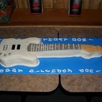 Bass Guitar I bought the Wilton guitar pan but decided to carve the cake myself instead. Good thing since all the cake got eaten and this one was much...