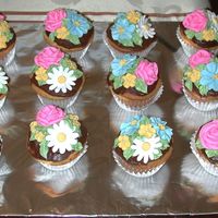 Flower Cupcakes Cupcakes I made for a friends wedding shower. They were a big hit.