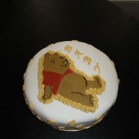 Pooh Cake This was my first attempt at a chocolate transfer. It's a FV cake with FV Mousse filling, covered in fondant and bc writing.