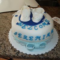 Baby Booties This was my first attempt at making the baby booties without the cutters. FV Cake with fresh strawberry filling from CC, covered in fondant...