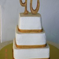 90Th Birthday Chocolate cake with chocolate buttercream filling, iced with vanilla buttercream, gold ribbon with gold rhinestones