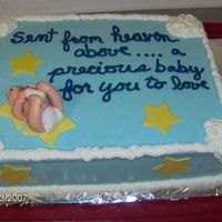Baby Shower chocolate cake,bc icing and filling with fondant baby and stars. 2nd try and fondant figure. Writing getting straighter ,cheated by marking...