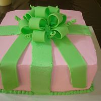 Birthday Cake White cake, whipped icing and fondant bow.