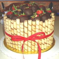 Sil Birthday Cake 3 Layers of Chocolate fudge cake, chocolate fudge icing and fresh strwberries, a layer of Ding Dong fiiling with fresh strawberries, iced...