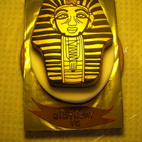 Alpha Phi Alpha Birthday Cake 14 x 9 oval covered in ivory Satin Ice, old gold and black pyramid border, cut-to-shape second tier covered in chocolate Satin Ice, plain...