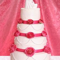 Pearls & Roses This is my first cake. I volunteered to make the wedding cake for my daughter's wedding to help her cut down on cost. She loved it as...