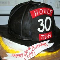 Fire Helmet I made this from the tutorial on this site! It was marble cake buttercream and chocolate fondant. I used the wilton soccerball pan, and 2 9...