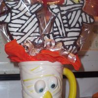 Mummy Cookie Bouquet There are the mummy cookies I made, but I put some on sticks and in these mugs:) I thought the mugs were so cute! I got them at the dollar...