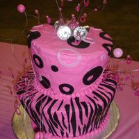 Diva Cake Pink and black with fondant zebra stripes and circles. Wire with fondant balls and dollar store rings