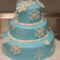 Snowflake Cake Light blue fondant with royal icing stenciled snowflakes on the fondant. The other snowflakes are hand-piped royal icing with edible...