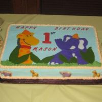 Giraffe And Elephant This is another piping gel transfer. They are both filled in with cookie icing. The animals on the side of the cake are Italian cookies...