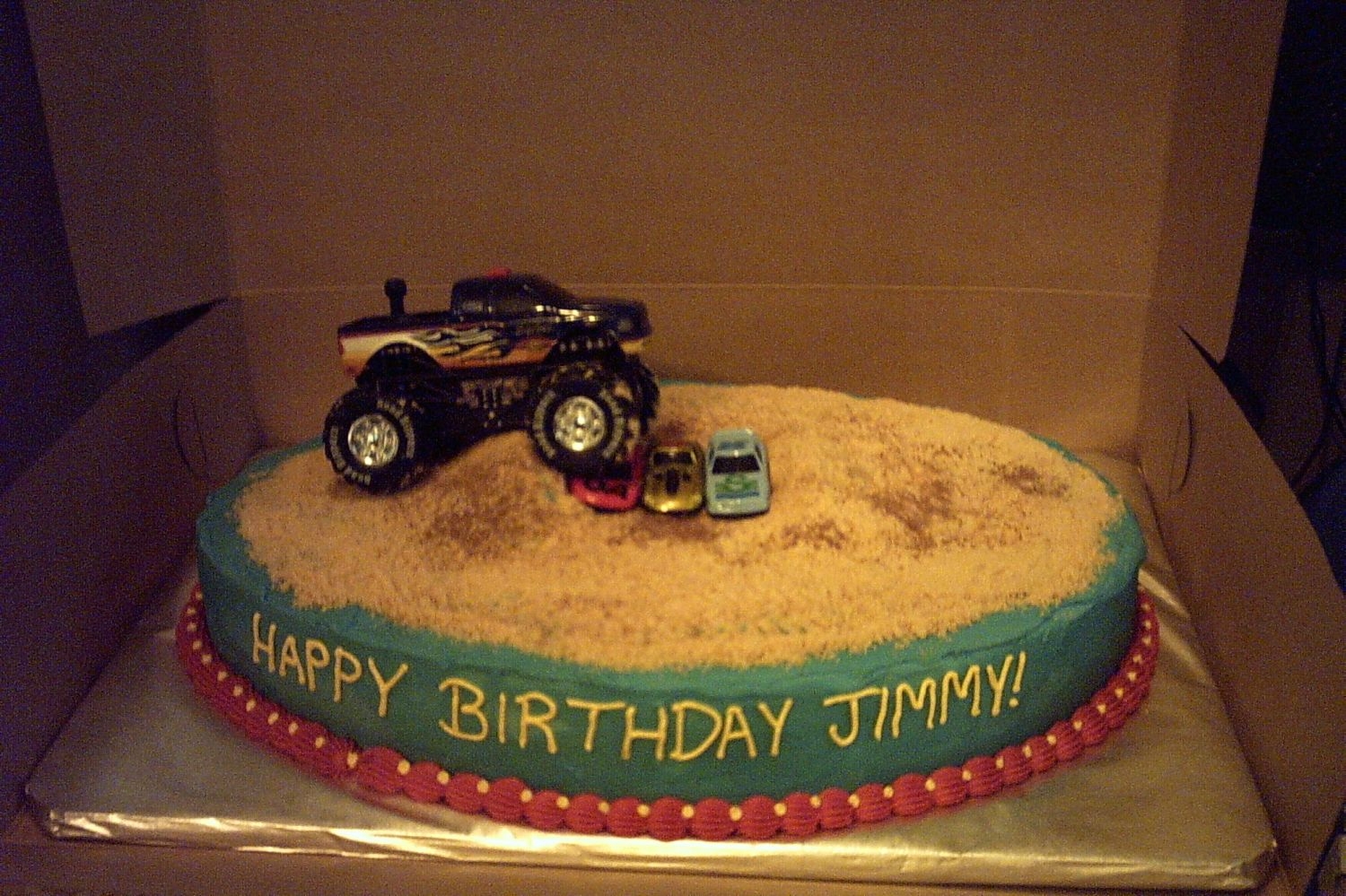 Monster Truck Ralley Quick b-day cake for my nephew. Chocolate lover's cake w/ bc icing and toy truck and cars. Cookie crumb "dirt" highlighted w...