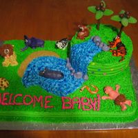 Jungle Themed Baby Shower Cake Thanks to everyone on this site for the ideas for this cake!Vanilla sheet cake and chocolate 8inch round cake covered in BC icing. Animals...