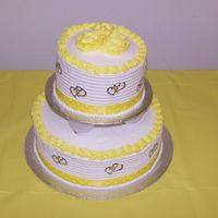Yellow Bridal Shower My first event cake. 10 inch french vanilla and 6 inch dark chocolate fudge with buttercream. I was very pleased with the end result.
