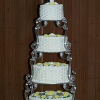 My First Wedding Cake! This was my first wedding cake and it was my gift to a cousin for her wedding. I couldn't believe it turned out so well or that she...