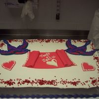 Rock And Roll Wedding This is one of 5 different cakes that I made for my friends wedding. It was fun! The Sparrow is royal, the banner and hearts are white choc...