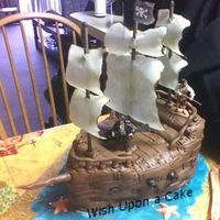Pirates Of The Caribbean Cake is covered with MMF, each plank place individually (I covered with white then airbrushed brown, then rolled out brown MMF...). The...
