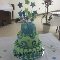 Blue, Green And Funky All Over So this was originally going to be a mad hatter style cake...until my practice run split in two...thankfully, the bride was willing to go...