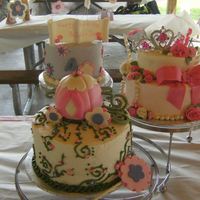 A Princess Turns 1 Birthday Cake for my friends daughter, turning 1, a whole princess theme. Single layer 6" lifted off middle cake for smash cake