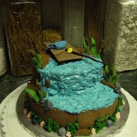 Dock Fishing My MIL wanted a very small 6" yellow cake w/chocolate buttercream for her neighbors birthday, I was told he liked to fish. I already...