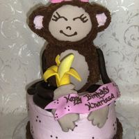 Pink Monkey Birthday Cake 3-D RKT Monkey iced in Chocolate BC with fondant accents, sitting on an 8" marble cake. I loved making this cake, was lots of fun and...