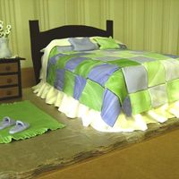Bedroom Quilt Birthday cake for woman who does a lot of quilting. Headboard and night stand are chocolate fondant, everything else is Vanilla Satin Ice....