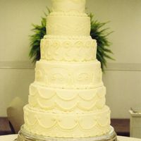 Wedding_Tower_0004.jpg I am very proud of this cake. It was all buttercream, each layer a different design. The bride gave me a photo from a bride magazine and it...
