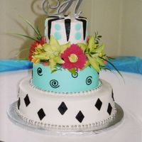 Ashley.jpg all deocrations are in decorator icing. I learned a hard lesson on this one. I put the black diamonds on and the next morning each diamond...