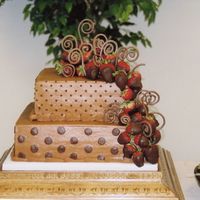 Fleming.jpg chocolate buttercream dots and strawberries attached with toothpicks. I love how this cake turned out. Also this was the first time I tried...