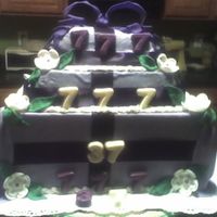 Born 7-7-1970 Believe it or not the bottom is a box decorated with foundantsecond layer is yellow with strawberry filling and top is yellow cake filled...