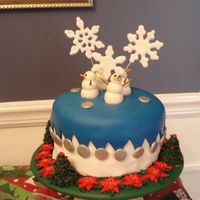 Christmas Cake The cake was covered in a base of white MMF, then a circle of blue layed on top, and snipped it with kitchen scissors freehand. Silver...