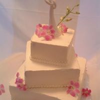 My First Wedding Cake Thankfully, the first wedding cake order I had was quite simple...meringue icing with beaded borders and fresh orchids! It was a heavy bad...