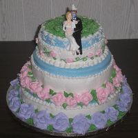 Blondie's Wedding Cake The bride wanted lots of color and Carolina blue. The groom wanted coconut on top. The groom's 6-year-old wanted white stars on the...