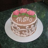 Mom This was my first attempt at roses - I thought they looked like crap, but mom loved her cake. It was chocolate with vanilla/caramel...