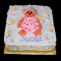 Feminine Bear Cake the bear created is similar to the bear belonged to the birthday girl