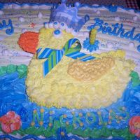 Duckie Cake With Crown... A little boy is turning one.A yellow duckie prince is so much fun!Sure glad my cake is done...!!!