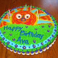 Sunshine Cake My 6 year old wanted sunshine and grass on her cake.