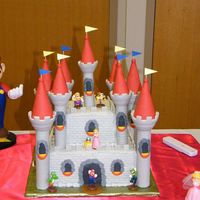Mario Castle My Pride & Joy!!!! 6 & 10 in square cakes. Once the cake was iced just to detail this cake took me 10 hours to finish! Cake is iced...