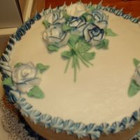 Rose Fancy This is just a simple 2 layer cake with dark blue/ white butter cream icing With a star border.This is just one of the cakes that I have...
