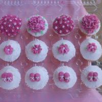 Pic.jpg my first cupcakes...second attempt at decorating anything. merschino cherry buttercream icing