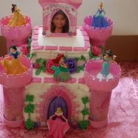 Princess Castle Disney Princess Castle cake. 11x15 German chocolate cake with BC and strawberry filling.